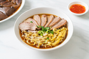 egg noodles with stewed duck in brown soup