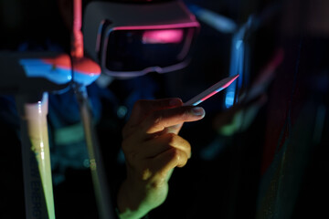 Focus on wind turbine energy engineers analyzing wind energy and electricity in the lab.