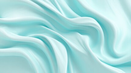 Fototapeta premium Light blue fabric flows softly creating beauty with its gentle curves and smooth texture.