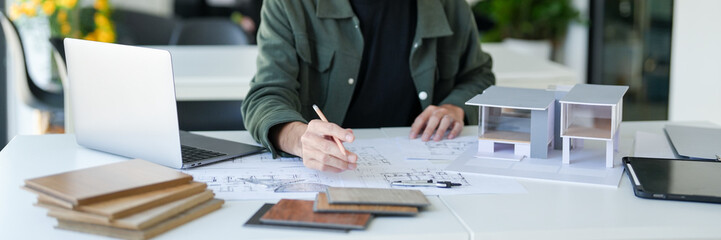 Architecture Man drawing on architectural Creative project business architecture building...