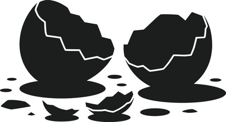 Black broken eggshell halves and fragments on white background