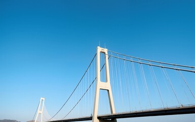 Obraz premium A photo of a bridge taken from a low angle with a blue sky in the background. represents civil engineering. High quality