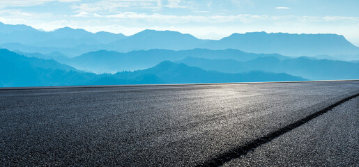 Asphalt highway road and green mountain natural landscape in the morning