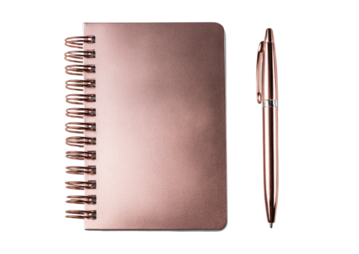 A rose gold notebook with spiral binding and a matching pen, set against a black backdrop