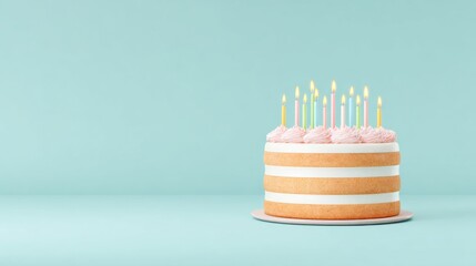 Multi layered cake with pink frosting and burning candles on a light blue background