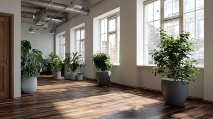 Bright room with hardwood floor featuring potted plants near windows and exposed ductwork on ceiling