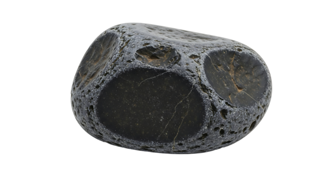 Dark gray stone with circular indentations and rough texture rock