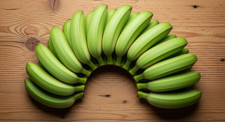 Unripe green bananas arranged in a horseshoe