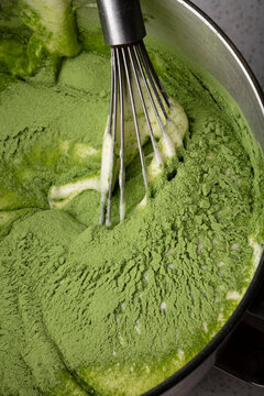 Whisking green macha cake batter 