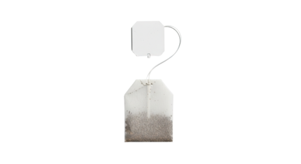 A single tea bag with a white tag and string isolated on a white background.