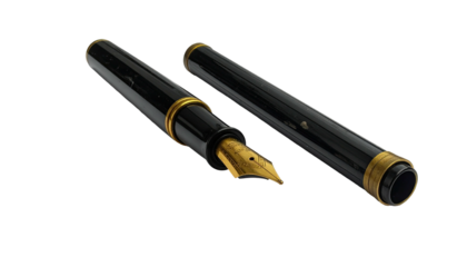 Open, black fountain pen with gold accents on a black background