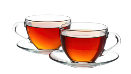 Two clear cups of tea with saucers, steaming on black