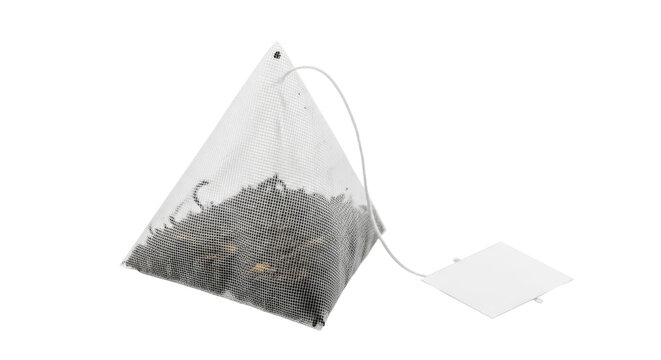 Pyramid tea bag filled with loose leaf tea.
