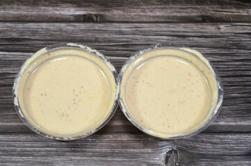 Tahini Tahina which is a Middle Eastern condiment made from toasted ground hulled sesame, served by itself (as a dip), with spices and herbs, Seafood Tahini used as a dip and an appetizer side plate