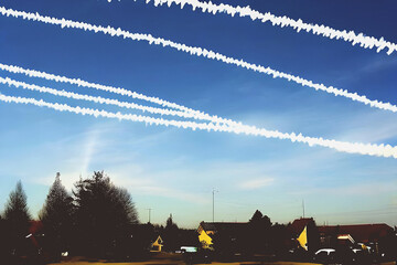 sky chemtrails over village . AI generated