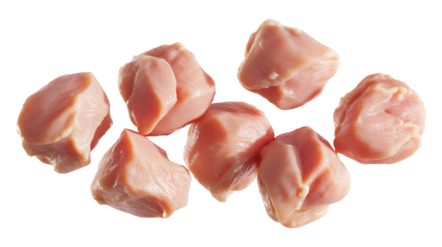 A small pile of raw, bitesized chicken pieces isolated on transparent background