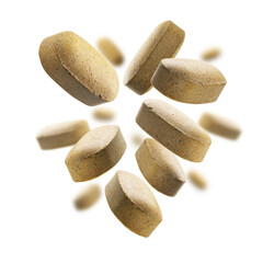 Yellow tablets levitate on a white background