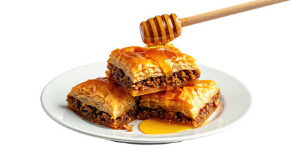 Stacked baklava drizzled with honey on white plate