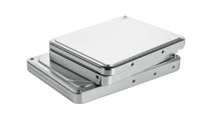 Stacked, shiny silver hard drives isolated against a black backdrop