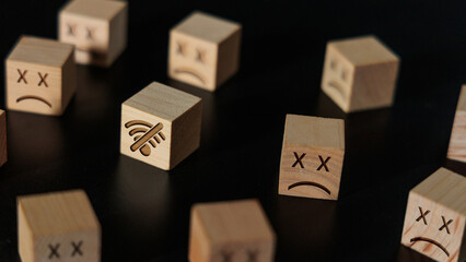 No Internet Connection Concept with Wooden Blocks and Sad Faces
