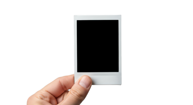 Hand holding a blank instant photo isolated on transparent background in studio