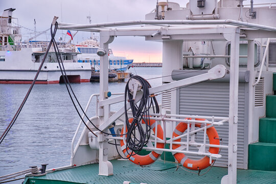 The stern of a boat with red lifebuoys in Sochi Harbor. Krasnodar Krai, Russia.