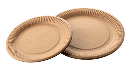 Two tan, disposable paper plates on a dark contrasting backdrop