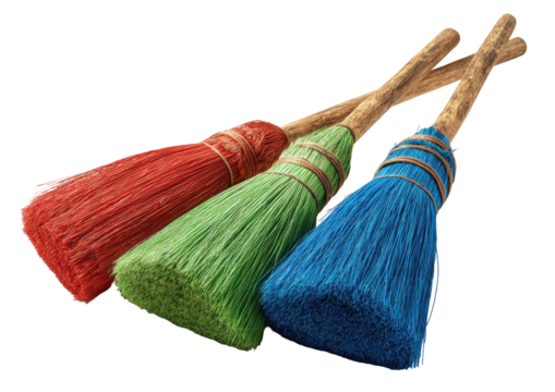 Three colorful straw brooms with wooden handles, on black background, slightly angled