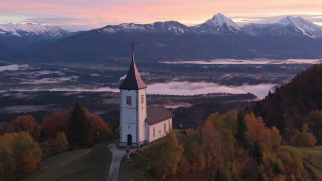 Jamnik church in Slovenia aerial view during sunrise