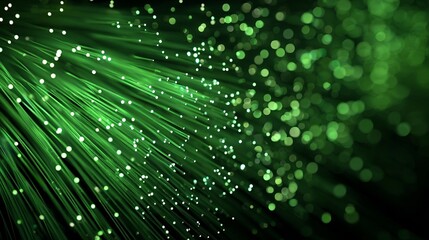 Fototapeta premium Vibrant green fiber optics glowing with bright light particles, symbolizing modern technology and data transfer