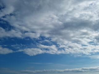 It's a sky with fluffy clouds and sunlight.