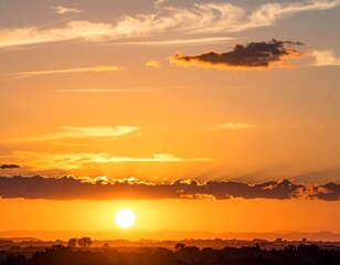 A vibrant sunset paints the sky with warm hues