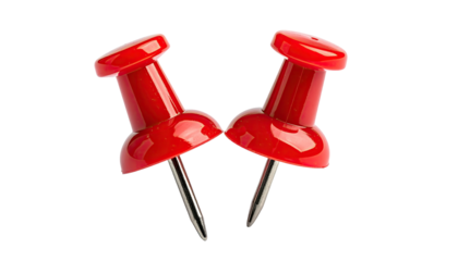 Two red pushpins angled, sharp needles against a black background