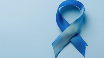 Blue ribbon symbol on light blue background for world diabetes day awareness and support. Horizontal banner. Copy space. Healthcare and medical concept. Parkinson's disease, Men's health