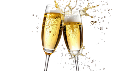 Two champagne glasses clink, creating a bubbly splash