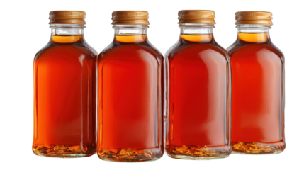 Four apple cider bottles stand on surface freshly pressed apple cider presented in glass bottles