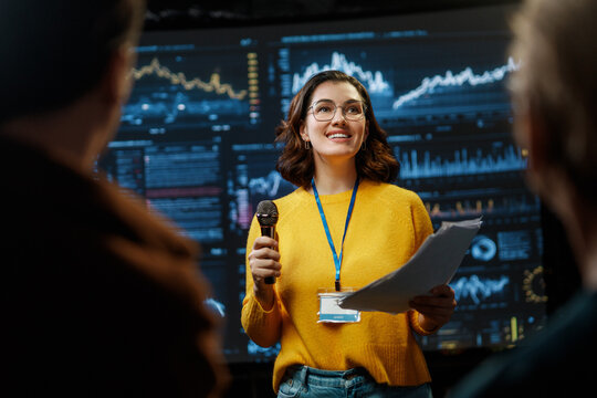 woman is giving a presentation at conference