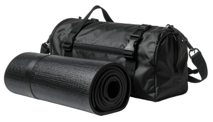 Black duffel bag beside rolled black yoga mat
