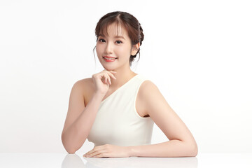 A beautiful young Asian woman with clean, fresh skin against a white background. Skincare, facial treatment, cosmetology, beauty, and spa. An elegant portrait of an Asian woman.