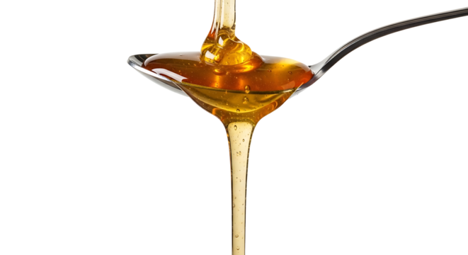 Golden honey pouring from a spoon sweet and viscous liquid Transparent