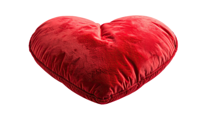 Lush red heart pillow isolated on black backdrop, softly lit