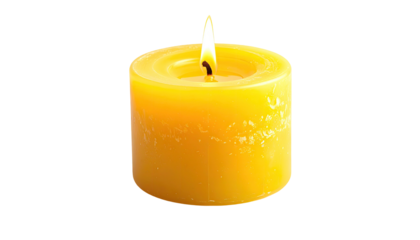 Lit yellow candle against black. Soft glow, short round form