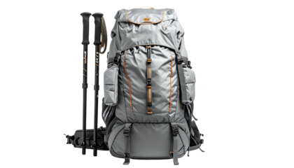 Grey backpack and trekking poles on black, outdoors adventure gear