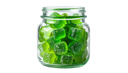 Green square gummies packed in a glass jar with ridges