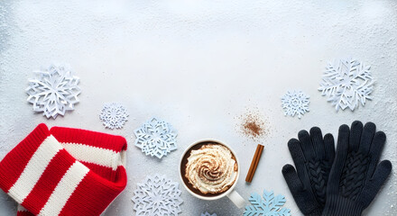 Winter Accessories and Hot Cocoa with Snowflake Accents on Blue

