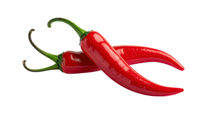 Two shiny red chili peppers overlapping on a dark background
