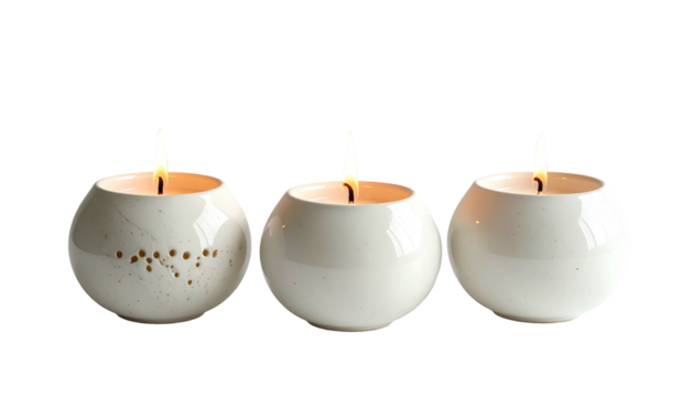 Three lit round candles arranged in a row against black