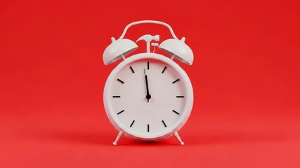 White alarm clock with hammer hitting it, centered on a red background