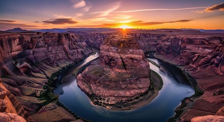 Stunning panoramic view of a horseshoe-shaped canyon carved by a river at sunset