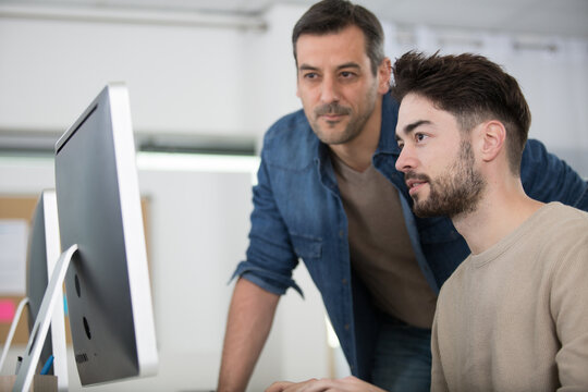 two entrepreneurs working and taking notes together in the office